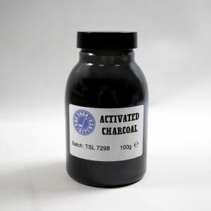 a jar filled with a black powder on with an activated charcoal label