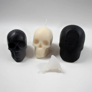 Skull silicone mould shown with included funnel and both a candle and soap made using the mould.